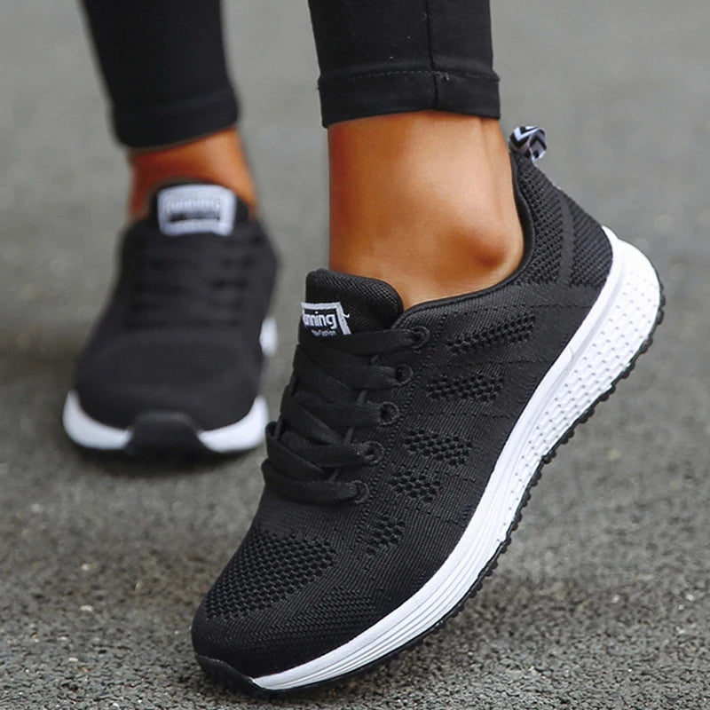 Black and white breathable mesh tennis sneakers for women with cushioned sole for all-day comfort