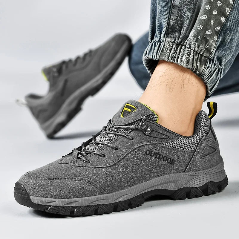 Close-up of gray men's hiking shoes size 46 with breathable mesh and reinforced toe cap for protection