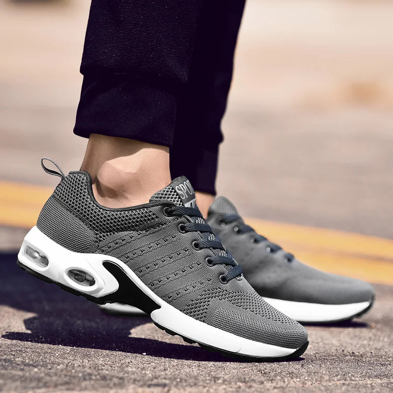 Gray orthopedic men's athletic trainers with air cushion technology for shock absorption and foot pain relief