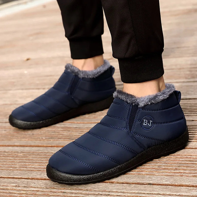 Woman wearing navy blue waterproof winter ankle boots outdoors showing comfortable fit and style