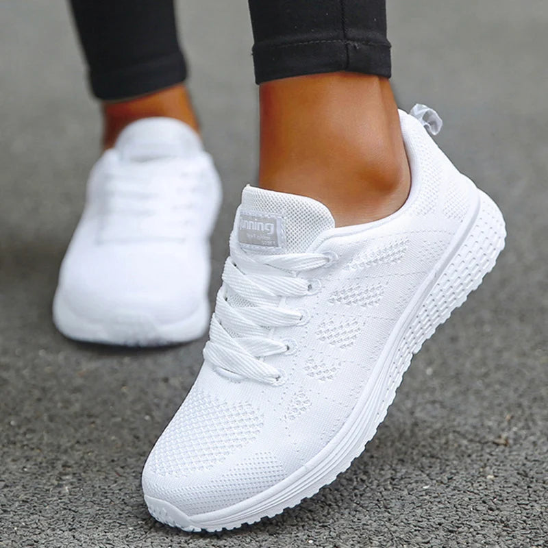Women's white breathable mesh athletic sneakers with lace-up design for running and walking workouts