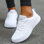Women's white breathable mesh athletic sneakers with lace-up design for running and walking workouts